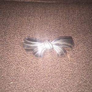 Classic silver bow hair clip approx 3” long.